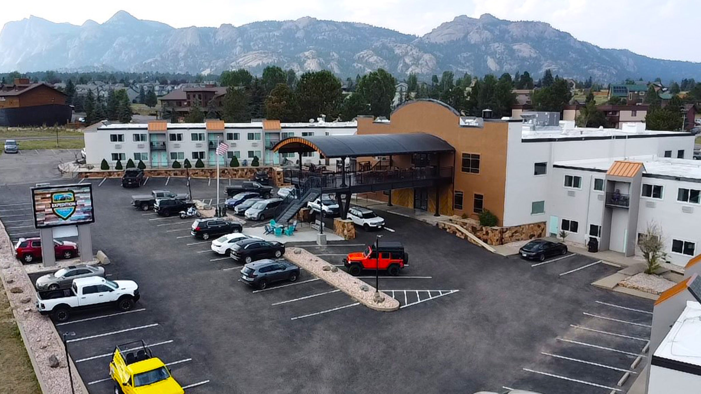exterior of hotel with the Rocky Mountains in the background